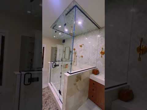 Glass shower doors installation for master bathroom.